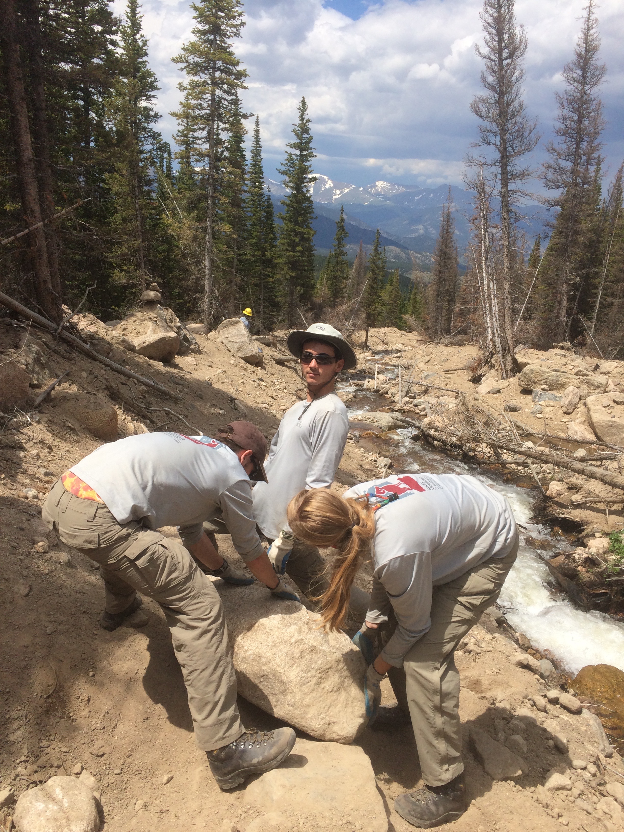 Teaming up to move a rock at Boulder Brook Landslide