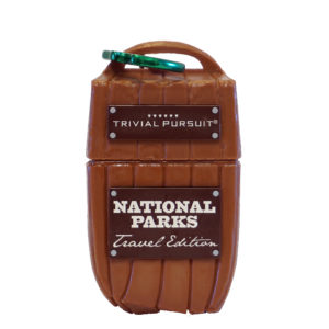 A brown suitcase with the words 'Trivial Pursuit - National Parks Travel Edition' on it.