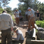 A group of people working on a trail.