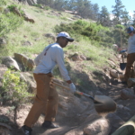 A group of men working on a trail.