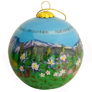 A Ornament RMNP Glass with a painting of mountains and flowers.