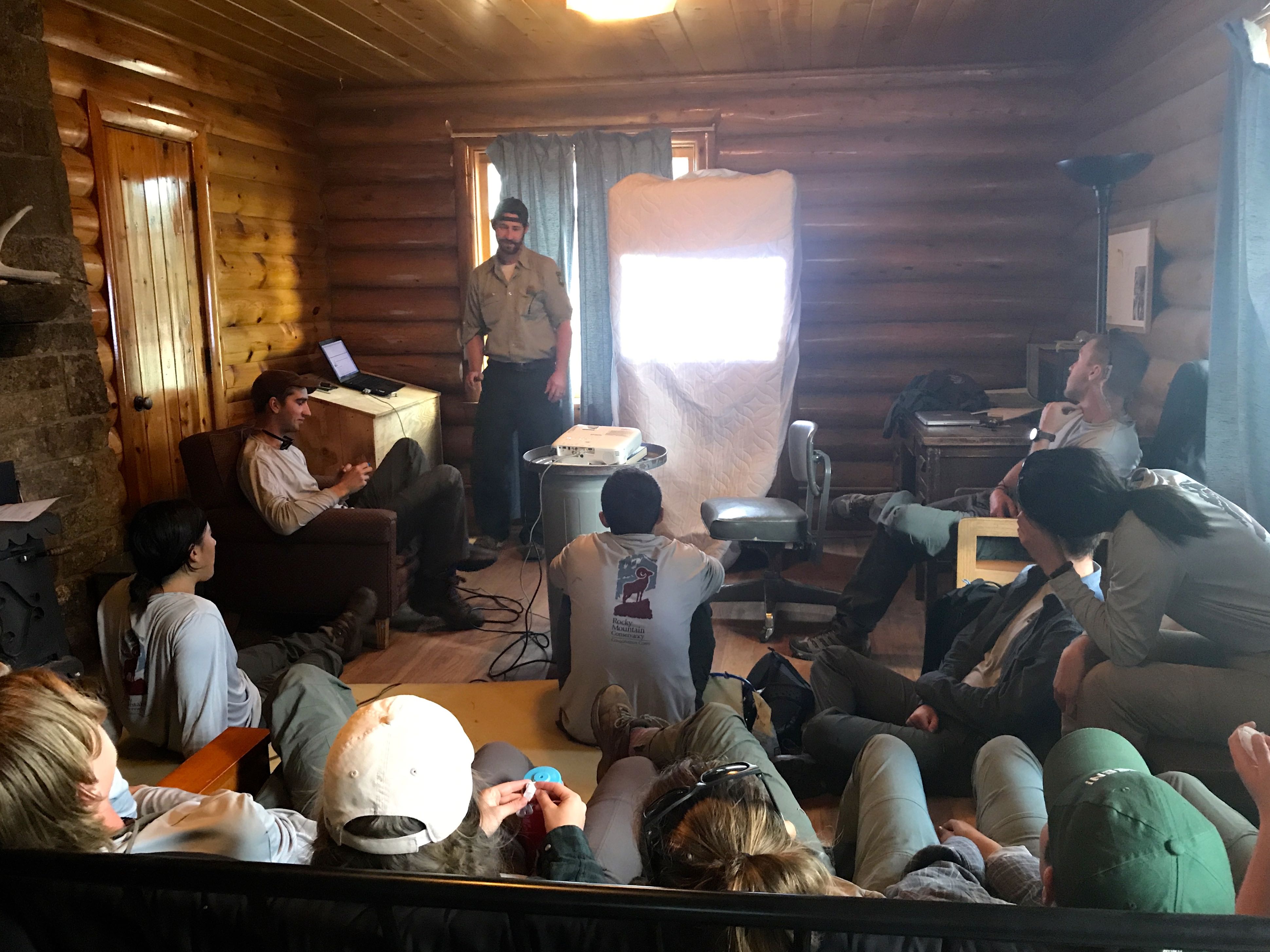 A park ranger giving an educational presentation to a group.