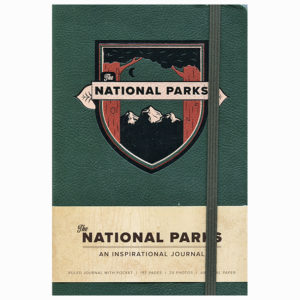 A green notebook with The National Parks - An Inspirational Journal logo on it.