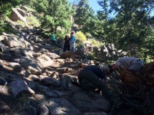 A group of people on a rocky trail.