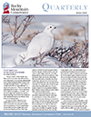 The cover of the quarterly magazine with a white bird in the snow.