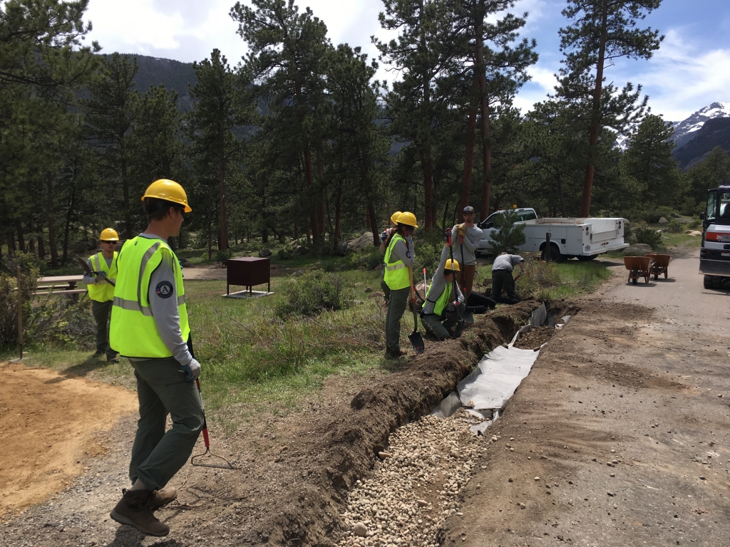 A group of workers are working on a road.