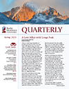 The cover of the quarterly magazine with a mountain in the background.