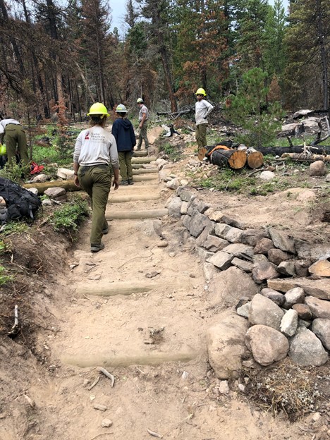 People building a stairs in the mountain