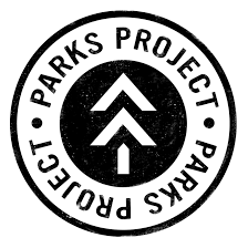 The park's project logo with an arrow pointing to the right.
