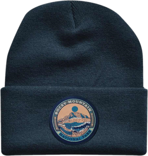 A Hat - Beanie RMNP Ornate Navy with an image of a mountain.