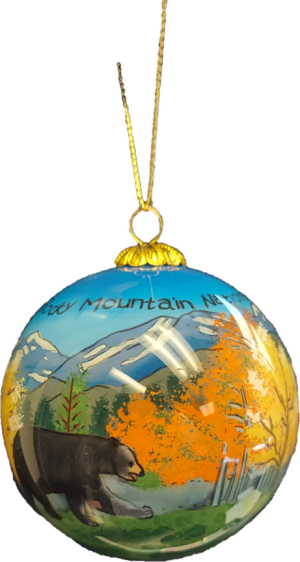 A RMNP Fall Bear Scene Glass ornament with an image of a bear in the mountains.