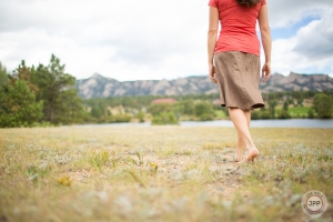 Woman walking bare foot on grass