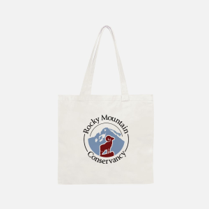 White canvas tote bag with "rocky mountain conservancy" logo print.