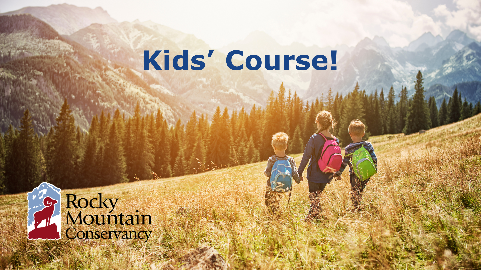 Landscape photograph with sunny mountains in the background, a conifer forest, and a grassy slope in the foreground. Three children wearing backpacks are walking away down the grassy slope. The Rocky Mountain Conservancy logo appears in the lower left-hand corner, and the words "Kids' Course!" are at the top of the image.