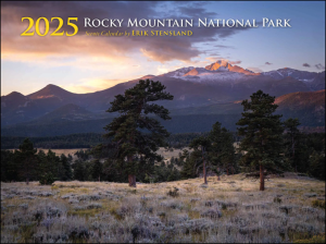 Cover of the 2025 Erik Stensland Scenic RMNP Calendar. The image shows a mountainous landscape with trees and a sunset sky.