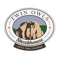 Logo of Twin Owls Steakhouse, featuring an illustration of rock formations with a light blue and green backdrop and text indicating it is located in Estes Park, Colorado.