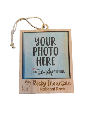 Ornament - Wooden Picture Frame with Elk, featuring "Your Photo Here" text and "Rocky Mountain National Park" branding, complete with a small illustration of an elk and a plane.