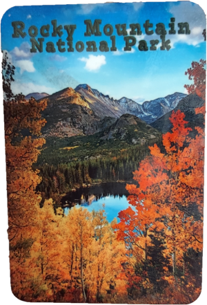 A landscape view of Rocky Mountain National Park, showcasing Bear Lake, a forest adorned with autumn foliage, and majestic mountains in the background. The text "Rocky Mountain National Park" is displayed at the top. Product Name: Magnet - RMNP Bear Lake in Fall.