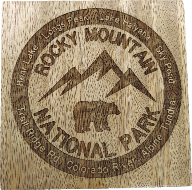 Coaster - RMNP Coaster Set of Four engraved with "Rocky Mountain National Park," featuring a bear, mountain peaks, and names of areas like Bear Lake and Longs Peak.