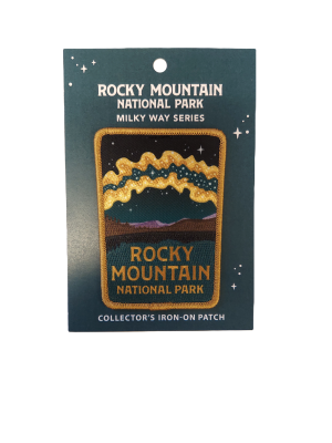 Iron-on patch named "Patch - RMNP Milky Way," showcasing a stylized night sky with stars and mountains, presented on a collectible backing card.